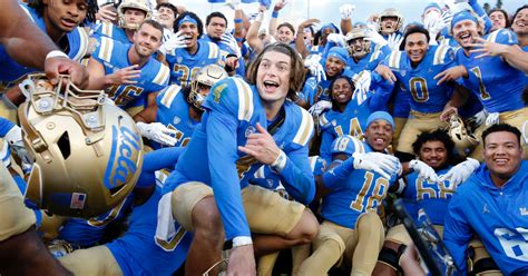 UCLA football players celebrate hire of DeShaun Foster as coach