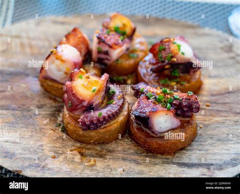 Spanish starter dish in fish restaurant in Getaria, grilled octopus ...