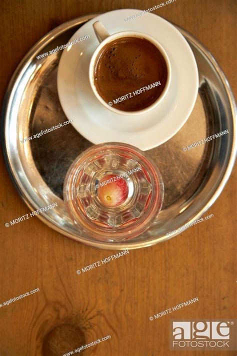 Espresso served with a glass of water, The House Café, designed by ...