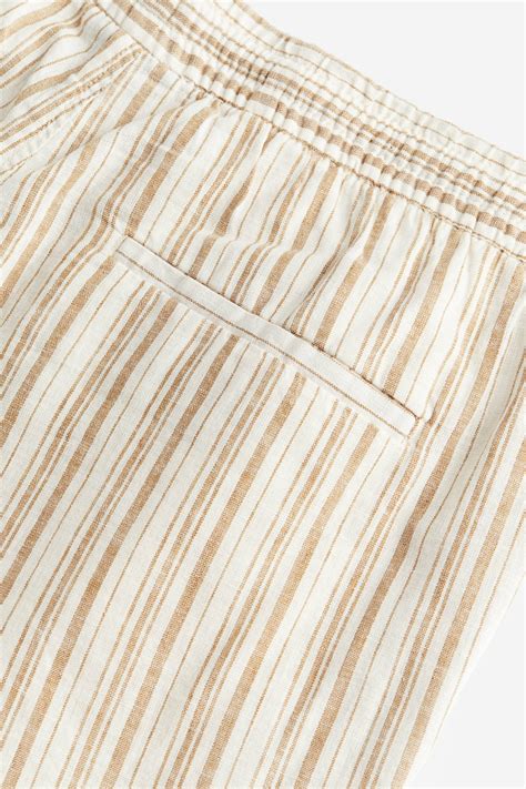 Regular Fit Linen-blend shorts - Beige/Striped - Men | H&M IN