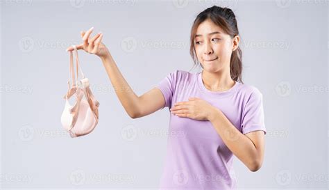 The young Asian girl took off her bra with a happy face 2877212 Stock ...