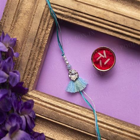 Buy Rachnaye Pastel Blue Rakhi Online in India - Mypoojabox.in