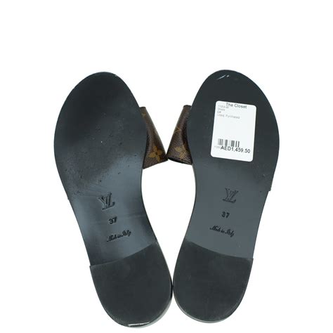 Louis Vuitton Monogram Lock It Flat Mules 37 – The Closet