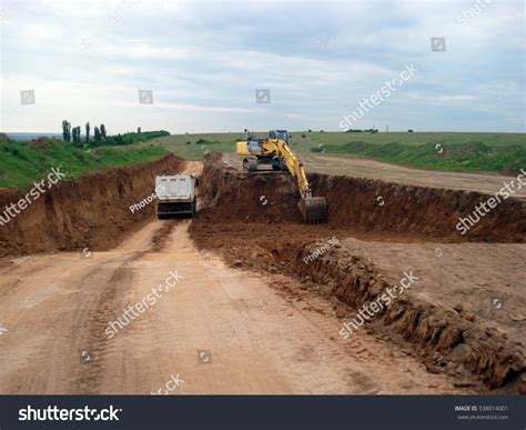 Image result for Large Excavators Loading Trucks