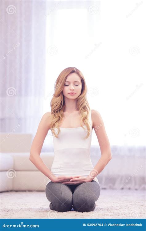 Young Lady Sitting on Her Knees Stock Photo - Image of healthcare ...