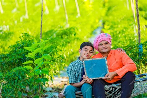 Premium Photo | Cute indian farmer child in school uniform with his ...