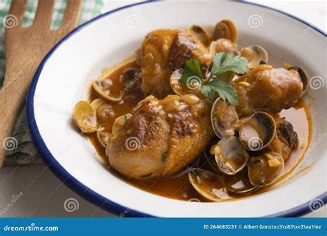 Chicken Thighs Cooked in Sauce with Clams. Spanish Tapa Recipe Stock ...