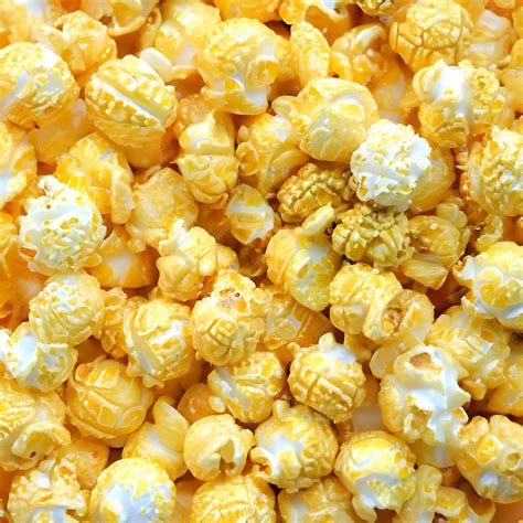 Premium Photo | A texture of yellow and white popcorn that are crunchy