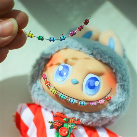 Playperdoll.th on Instagram: "💙Ready-made teeth braces on a labubu ...