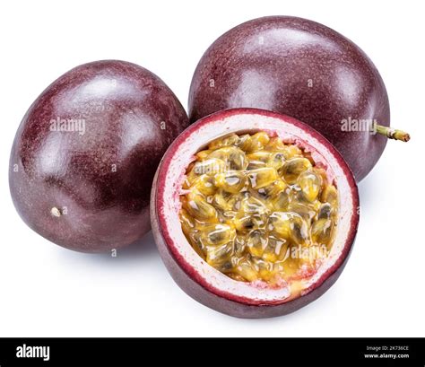 Dark purple passion fruits and half of fruit on white background Stock ...