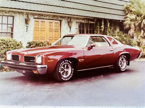 1973 Pontiac GTO, LeMans Sport Coupe, Florentine Red with white bucket seats, 400ci, 400TH his ...