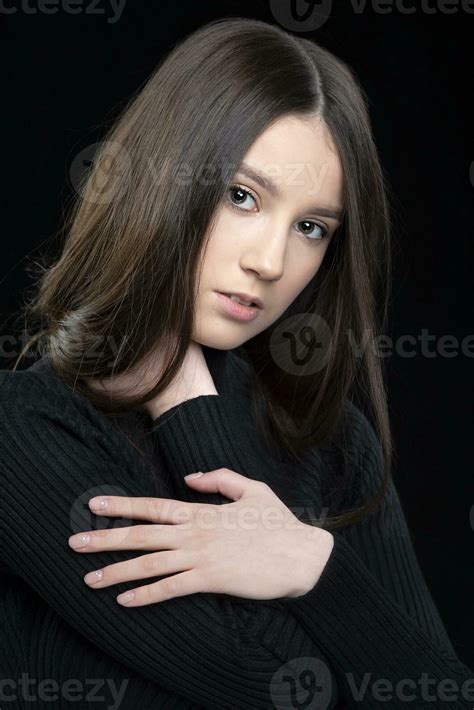 Vertical portrait of a beautiful seventeen year old girl with long hair ...
