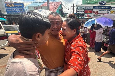 A released prisoner, right, is welcomed by her colleague after she was released from Insein Prison Sunday, Jan. 4, 2026, in Yangon, Myanmar. (AP Photo/Thein Zaw)