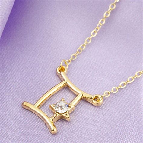 Buy Online Gold-Toned White Stone-Studded Star Gemini Pendant With ...