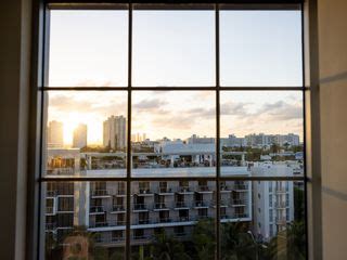 Download wallpaper 320x240 window, city, buildings, view nokia e72, e71 ...