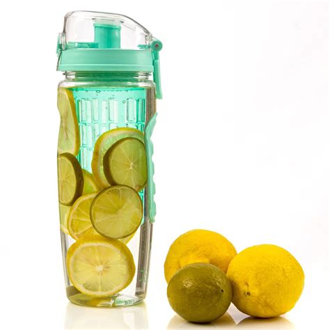 lemons and limeade in a blender next to it's glass container