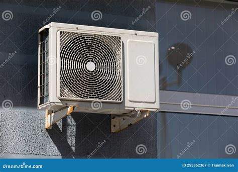 Outdoor Air Conditioner Unit on the Wall of a Building Stock Image ...