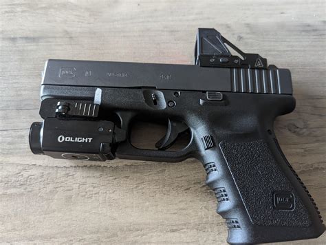 happy glocktober. my Glock 19 with a olight baldr mini and an atibal ...
