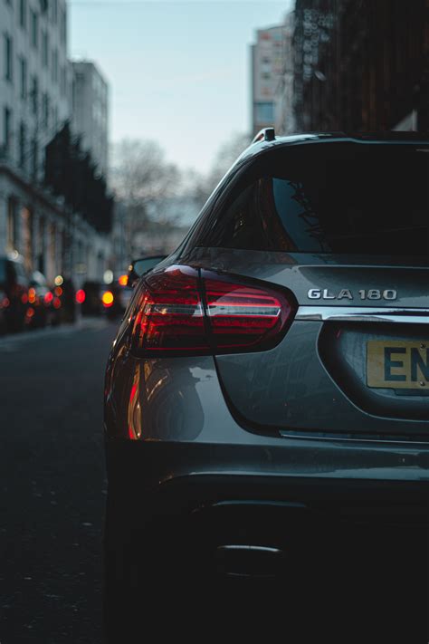 Download wallpaper 4000x6000 car, headlight, rear view, evening hd ...