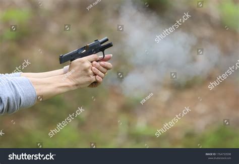 Image result for Bullet Shell Coming Out of a Gun