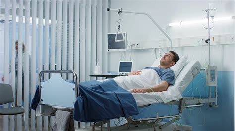 Sick Patient In Hospital Bed