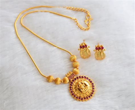 Gold tone pink stone lakshmi round necklace set dj-46486 – dreamjwell