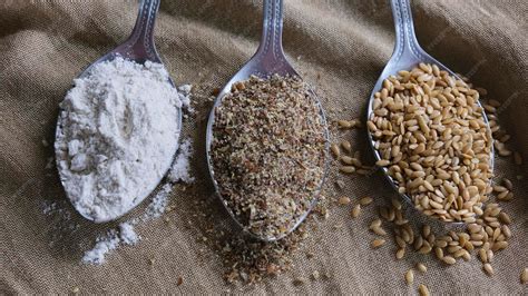 Premium Photo | Spoons with flax meal, ground flax and flax seeds