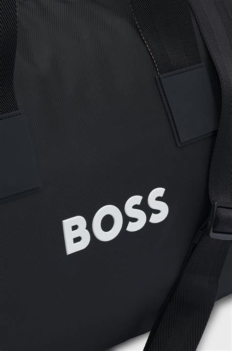 BOSS - Contrast-logo holdall with detachable strap - Black