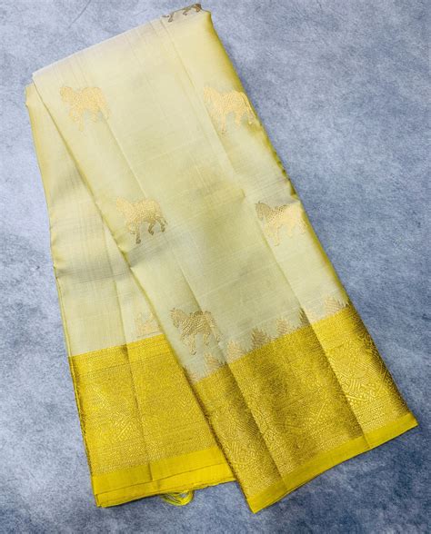 Pure Kanchipuram Silk Saree Ivory Colour with Light Yellow Border ...
