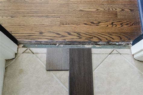 How to Install a Herringbone LVP Floating Floor Over Tile - DESIGN IT ...