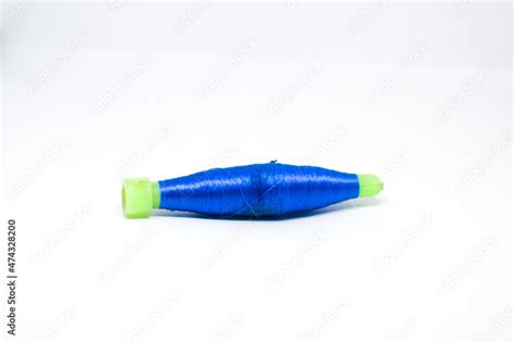 Spool of thread or traditional Indian silk yarn. Colorful thread rolled ...