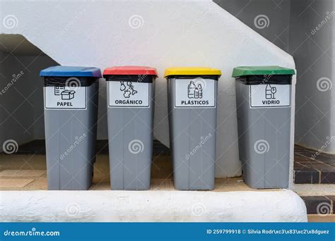 Four Recycling Garbage Cans, Reading in Spanish: Paper, Organic ...