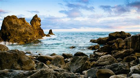 Download wallpaper 1366x768 rocks, stones, sea, coast, landscape tablet ...