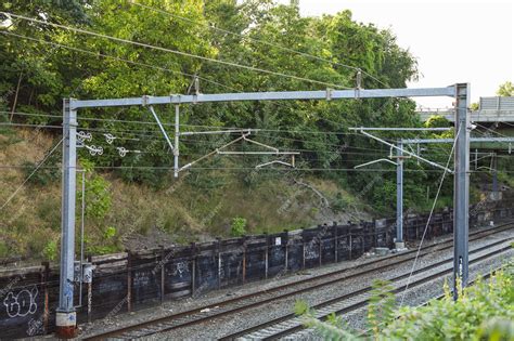 Premium Photo | Railroad tracks and a train represent journey ...