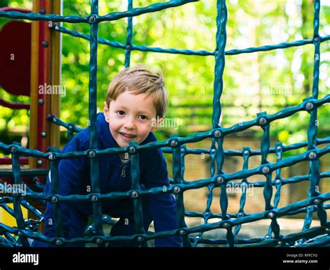 Little 5-year old boy playing on a playground. Active happy child Stock ...