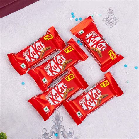 Send Designer Silver Rakhi with Roli Chawal N Chocolates Online ...