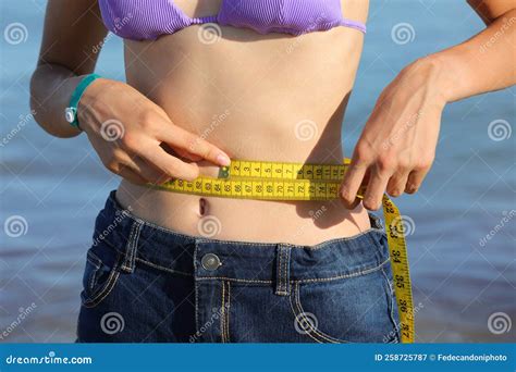 Skinny Girl Measures the Waist with Tape Measure Stock Image - Image of ...