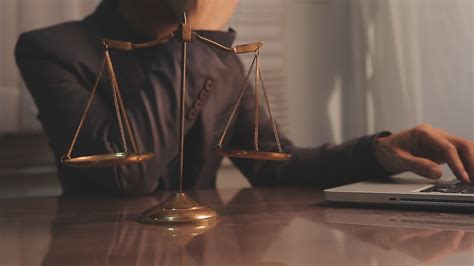 justice and law concept.Male judge in a courtroom on wooden table and ...