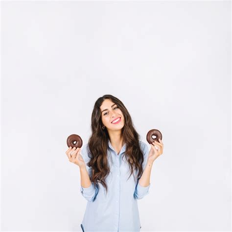 Woman with donuts in hands | Free Photo