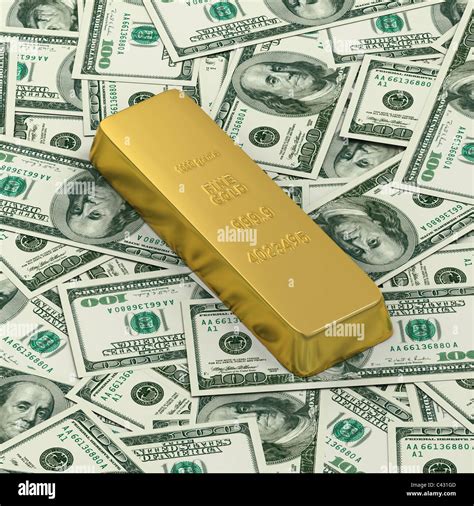 1000 grams or kilo golden bar or ingot on background of hundred dollar ...