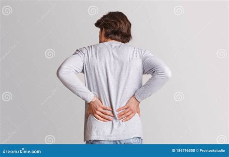 Body Ache and Kidneys Pain. Man Presses His Hands To Back Stock Photo - Image of hands, back ...