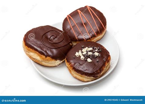 Chocolate Frosted Donuts stock image. Image of chocolate - 29519345