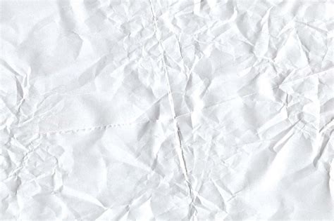 Download A White Paper With Crumpled Edges | Wallpapers.com