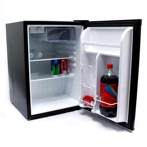 This sleek black compact refrigerator and freezer features a built-in ...