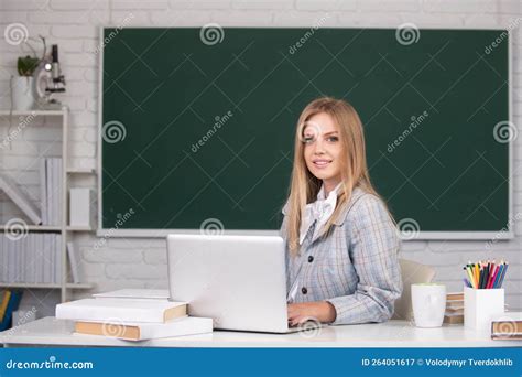 Young Teacher. High School Student Learning English or Mathematics in ...