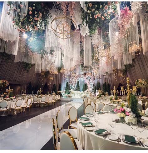 Luxury Wedding Decor: Elaborate Banquet Hall with Chandeliers and Flowers