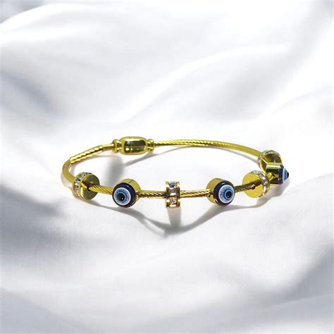 OMID Gold Toned Stone with Evil Eye Amulet Bracelet – OMID Luxury ...