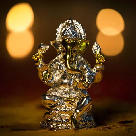 Buy Lord Ganesha Golden Silver Idol Online in India - Mypoojabox.in