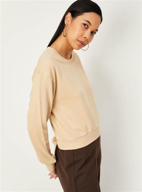 Buy Women Solid Drop Shoulder Sweatshirt Online at just Rs. 499.0 ...