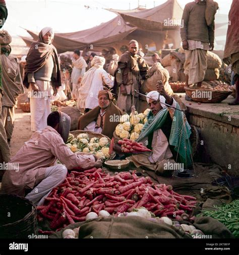 A vintage 1961 colour photograph showing traders in a Subzi Mandi, or ...